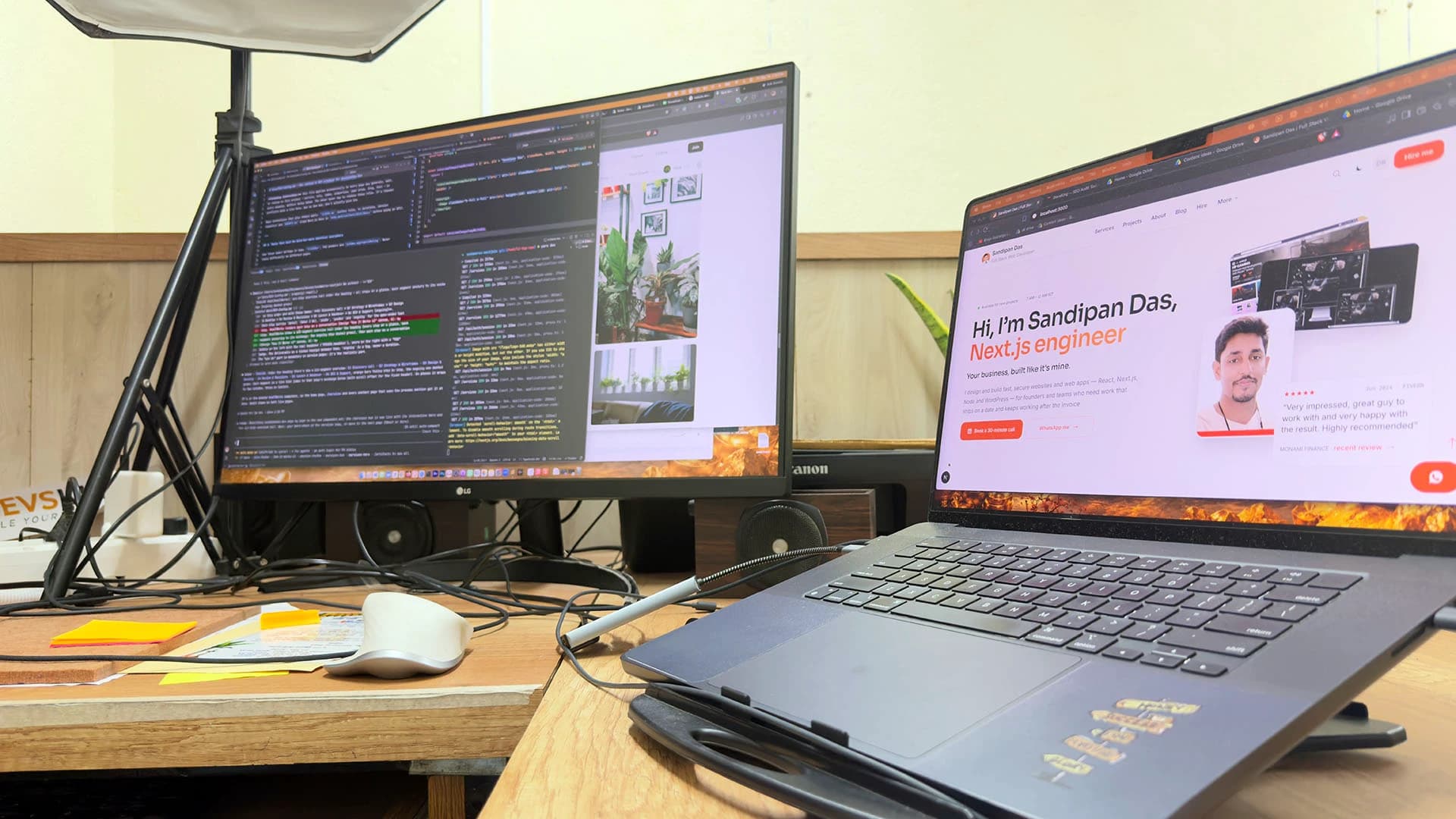 Sandipan Das's desk in Kolkata, India: a laptop with a site open beside a monitor showing code